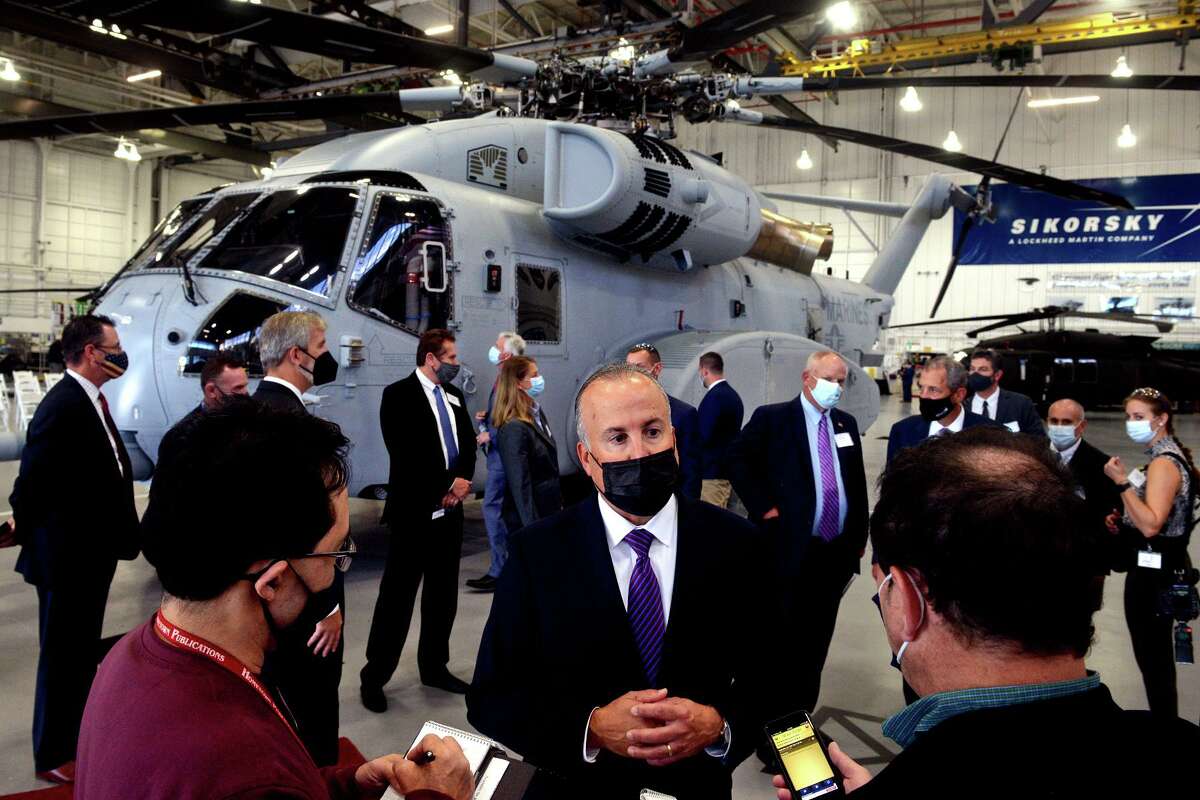 Paul Lemmo, president of the Sikorsky subsidiary of Lockheed Martin, in September 2021 with the company’s CH-54K King Stallion helicopter in the backdrop. Hiring at Sikorsky and other defense contractors has kept Connecticut's economy on pace with the nation's since the end of the pandemic shutdown in 2020. 