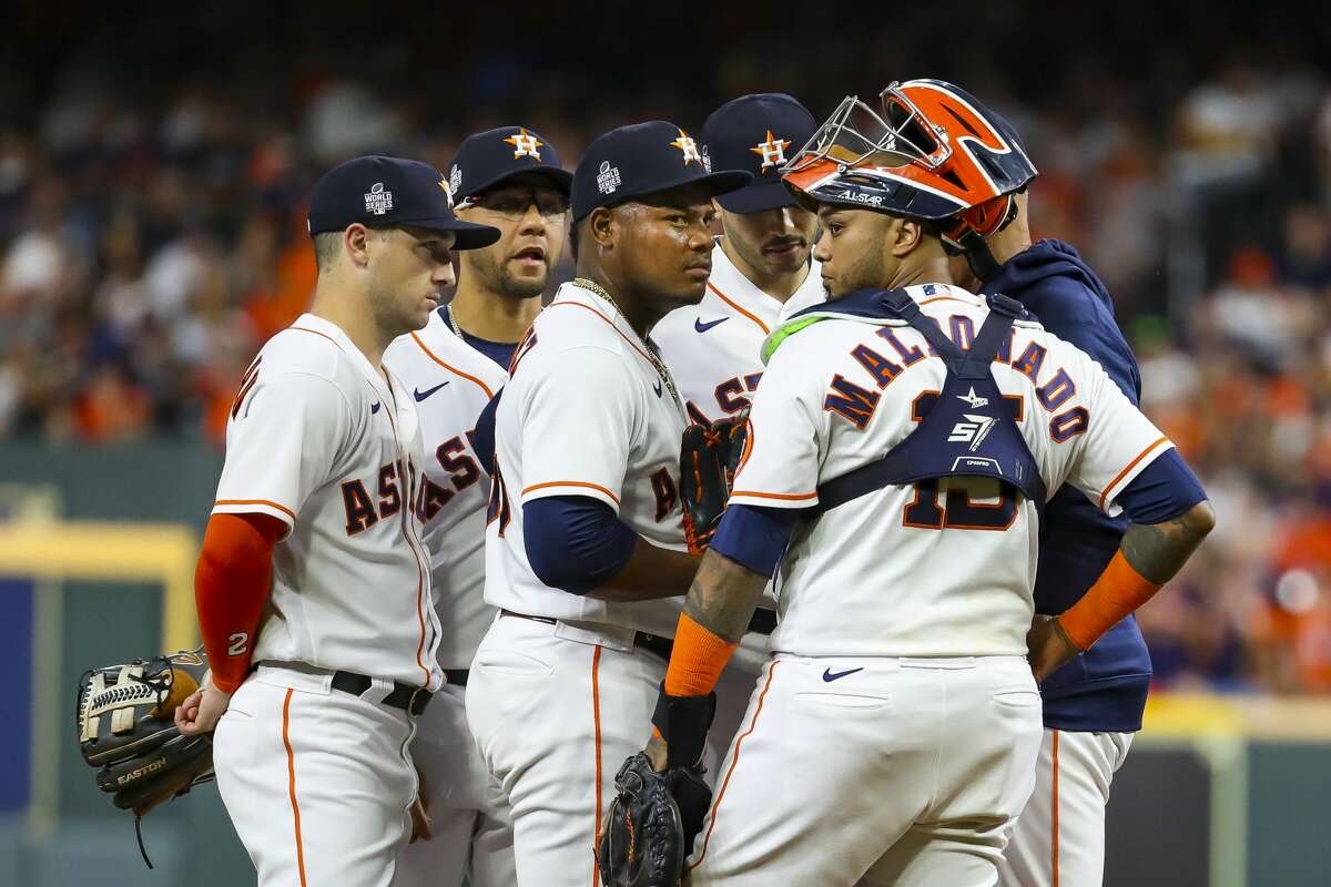 Houston Astros starting pitcher Framber Valdez (59) is surrounded by his team on the mound during the first inning in Game 1 of the World Series on Tuesday, Oct. 26, 2021 at Minute Maid Park in Houston.