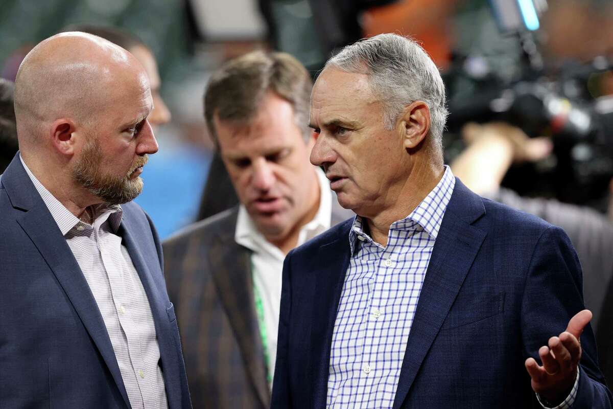 Major League Baseball Commissioner Rob Manfred (right) talks with Astros general manager James Click prior to Game 1 of the World Series between the Atlanta Braves and the Houston Astros at Minute Maid Park on October 26, 2021.