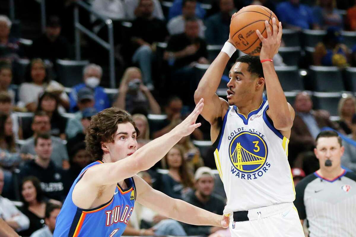 Golden State Warriors guard Jordan Poole (3) looks to pass away from Oklahoma City Thunder guard Josh Giddey, left, in the first half of an NBA basketball game Tuesday, Oct. 26, 2021, in Oklahoma City. (AP Photo/Nate Billings)
