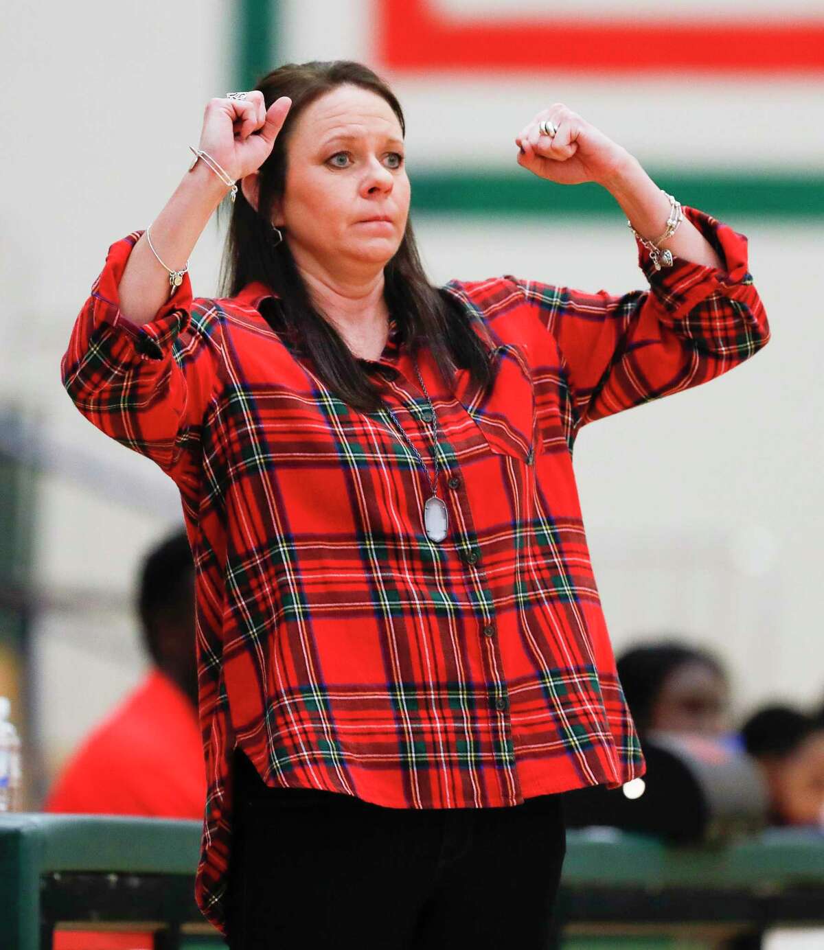 The Woodlands head coach Trista Tatsch reacts to a missed three-pointer during the third quarter of a District 15-6A high school basketball game at The Woodlands High School, Tuesday, Dec. 31, 2019, in The Woodlands.
