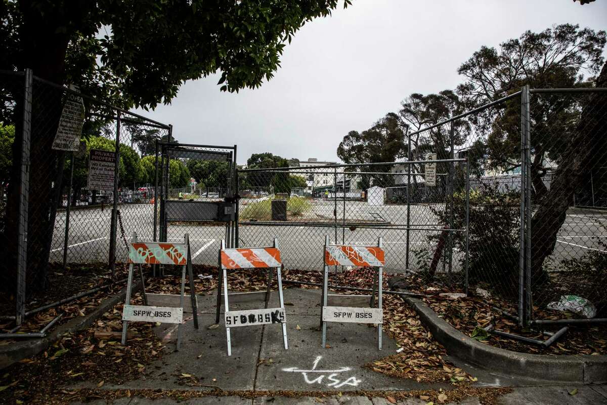 Barricades mark the perimeter of 730 Stanyan St., site of a former McDonald’s and recently a city-sanctioned tent encampment during the COVID-19 pandemic, in the Haight-Ashbury neighborhood of San Francisco.