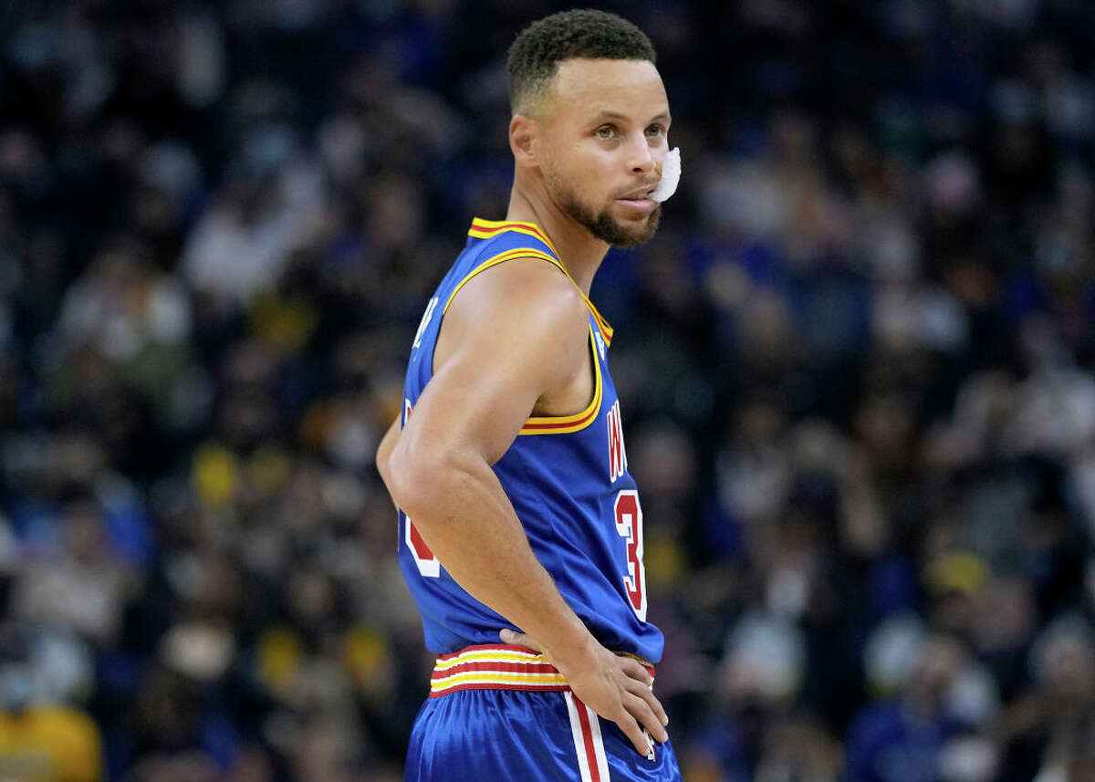 Stephen Curry of the Golden State Warriors looks on.