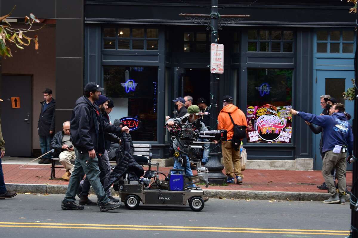 Film crew at the shooting of the Netflix movie "Mr. Harrigan's Phone," a Stephen King adaptation, in South Norwalk's Washington Street on Oct. 27, 2021.