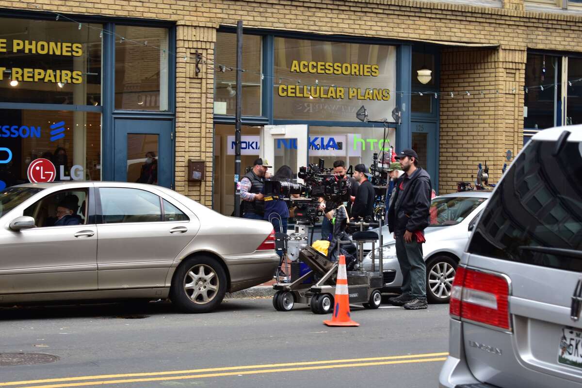 Film crew at the shooting of the Netflix movie "Mr. Harrigan's Phone," a Stephen King adaptation, in South Norwalk's Washington Street on Oct. 27, 2021.