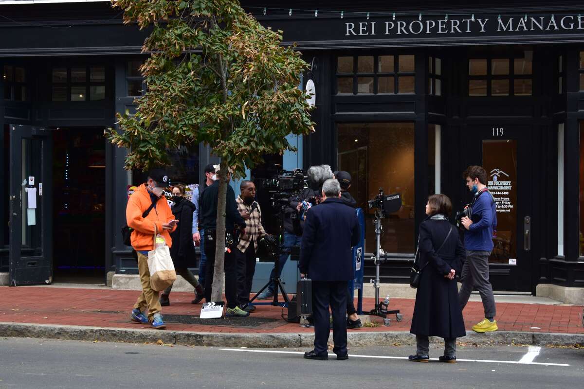 Film crew at the shooting of the Netflix movie "Mr. Harrigan's Phone," a Stephen King adaptation, in South Norwalk's Washington Street on Oct. 27, 2021.