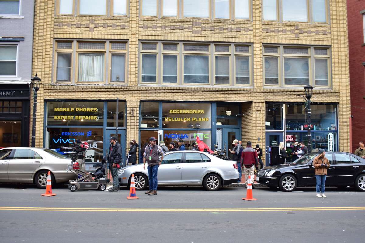 Film crew at the shooting of the Netflix movie "Mr. Harrigan's Phone," a Stephen King adaptation, in South Norwalk's Washington Street on Oct. 27, 2021.
