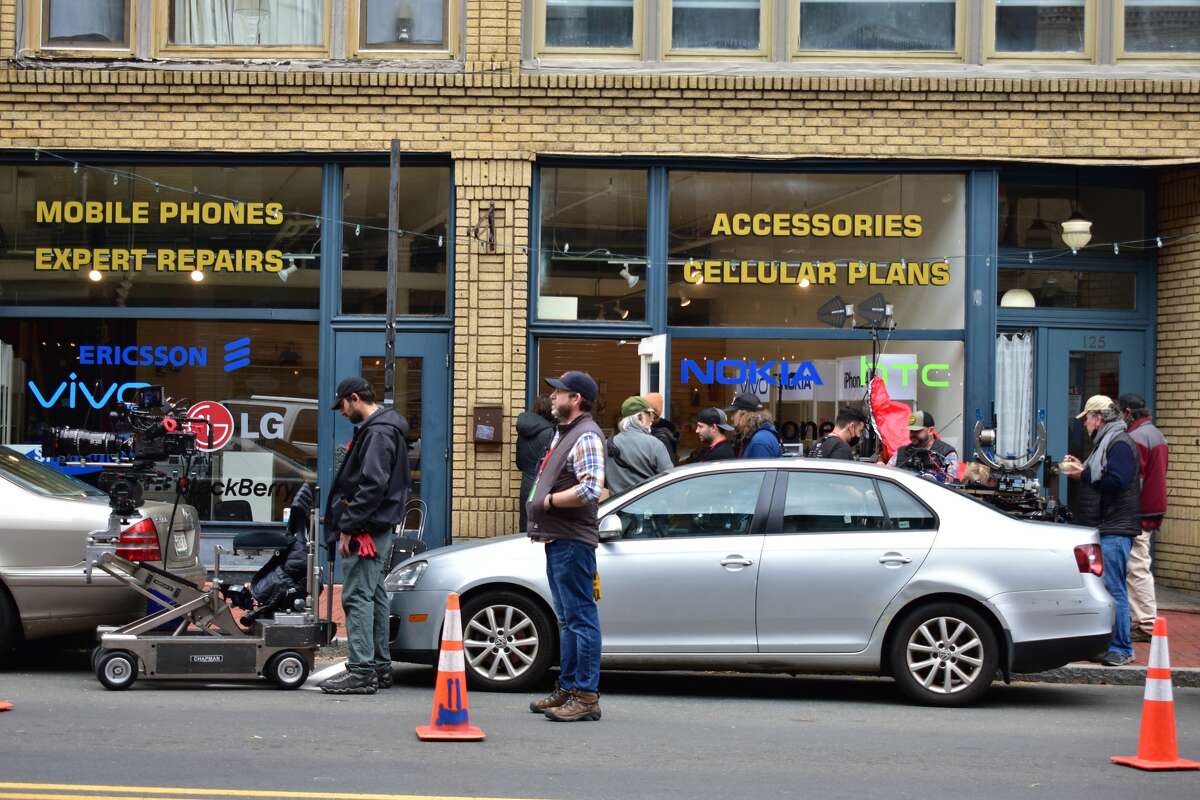 Film crew at the shooting of the Netflix movie "Mr. Harrigan's Phone," a Stephen King adaptation, in South Norwalk's Washington Street on Oct. 27, 2021.