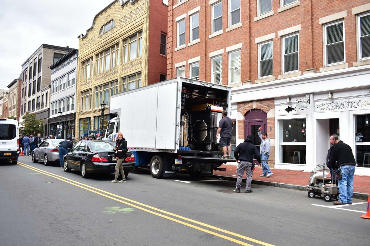 Film crew at the shooting of the Netflix film "Mr. Harrigan's Phone," a Stephen King adaptation, in South Norwalk's Washington Street on Oct. 27, 2021.