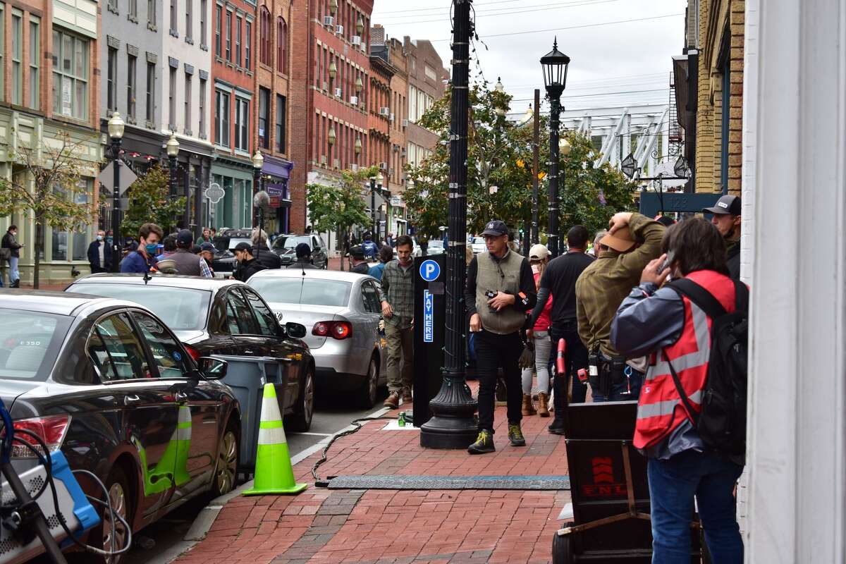 Film crew at the shooting of the Netflix movie "Mr. Harrigan's Phone," a Stephen King adaptation, in South Norwalk's Washington Street on Oct. 27, 2021.