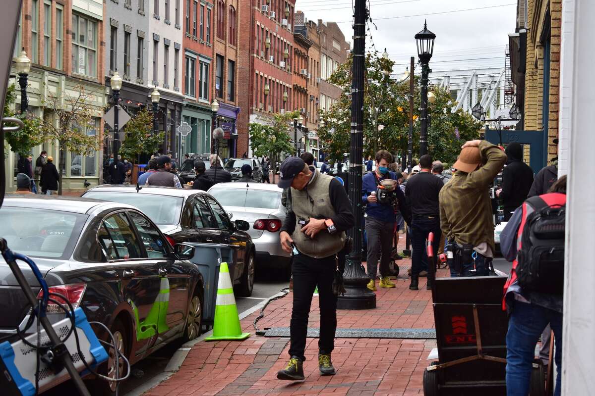 Film crew at the shooting of the Netflix movie "Mr. Harrigan's Phone," a Stephen King adaptation, in South Norwalk's Washington Street on Oct. 27, 2021.
