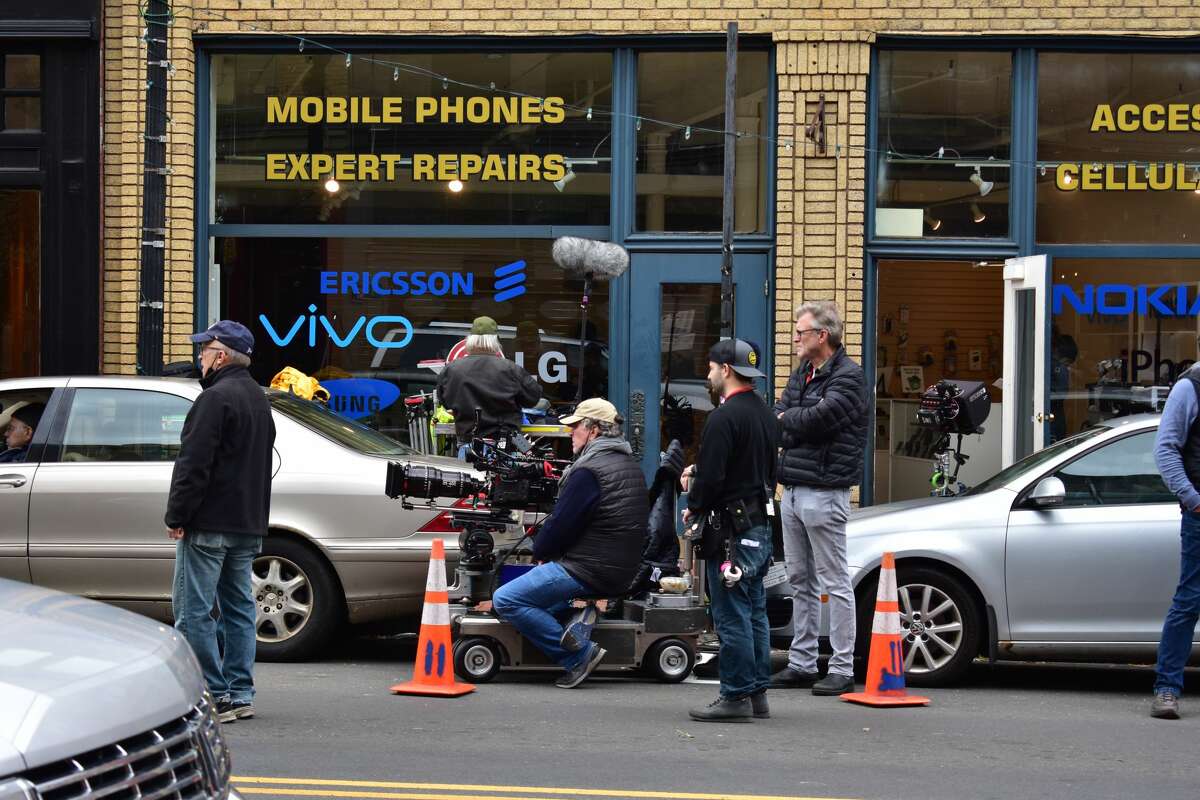Film crew at the shooting of the Netflix movie "Mr. Harrigan's Phone," a Stephen King adaptation, in South Norwalk's Washington Street on Oct. 27, 2021.