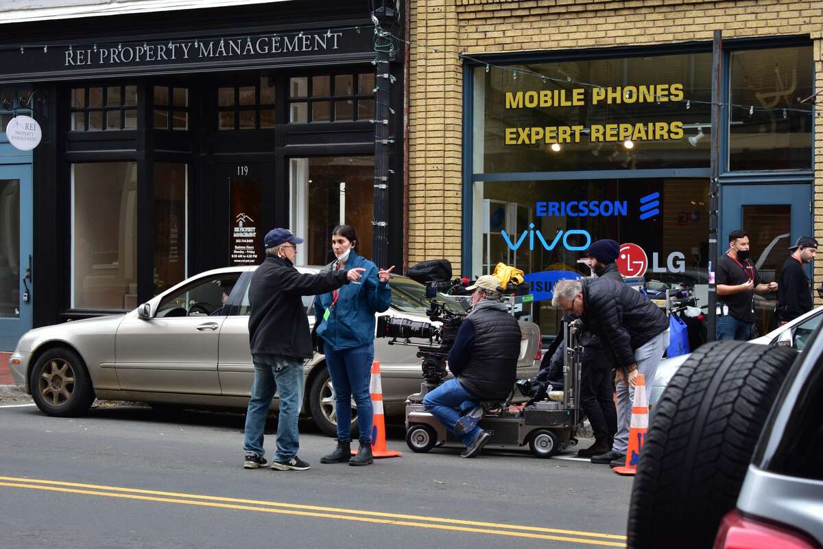 Film crew at the shooting of the Netflix movie "Mr. Harrigan's Phone," a Stephen King adaptation, in South Norwalk's Washington Street on Oct. 27, 2021.