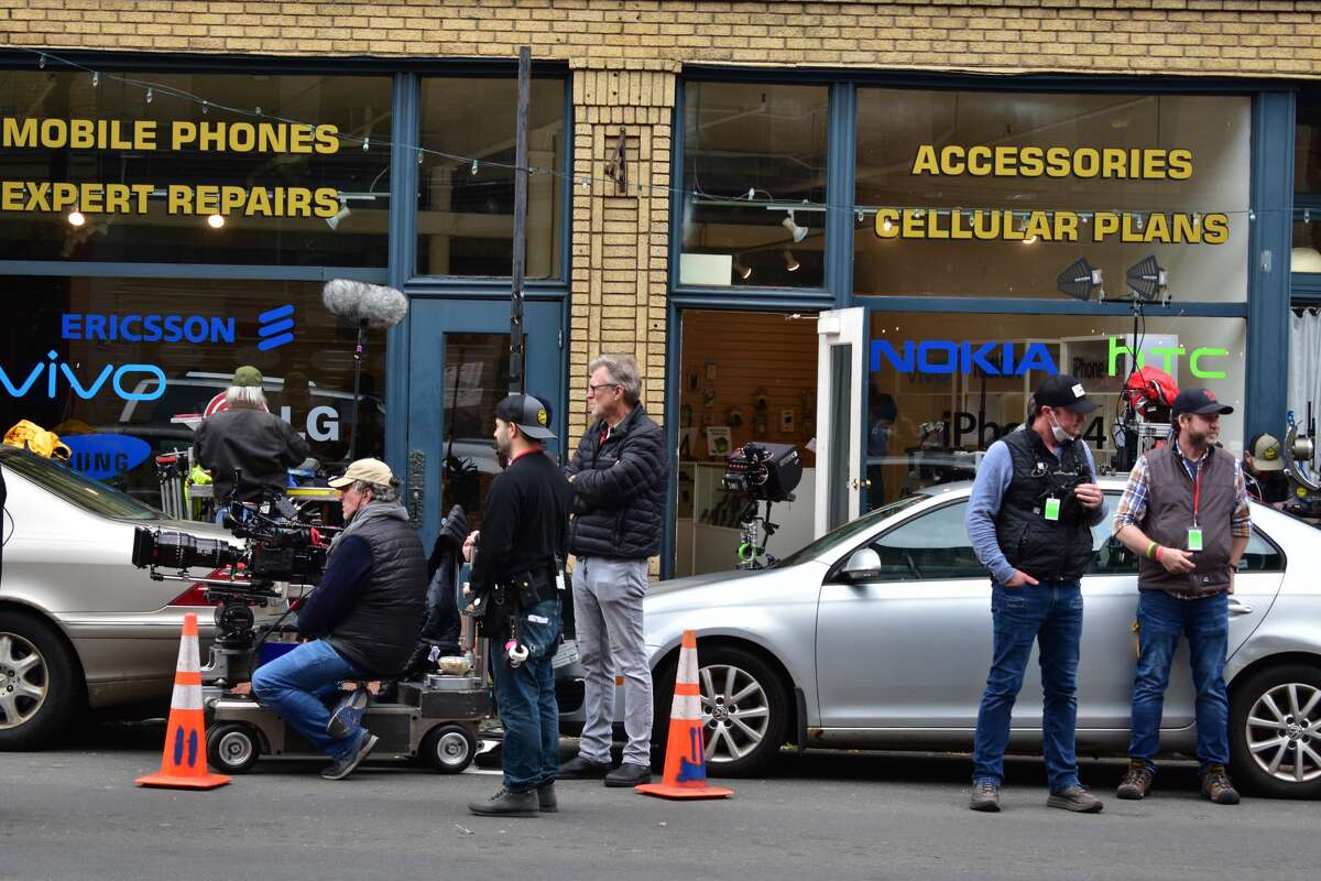 Film crew at the shooting of the Netflix movie "Mr. Harrigan's Phone," a Stephen King adaptation, in South Norwalk's Washington Street on Oct. 27, 2021.
