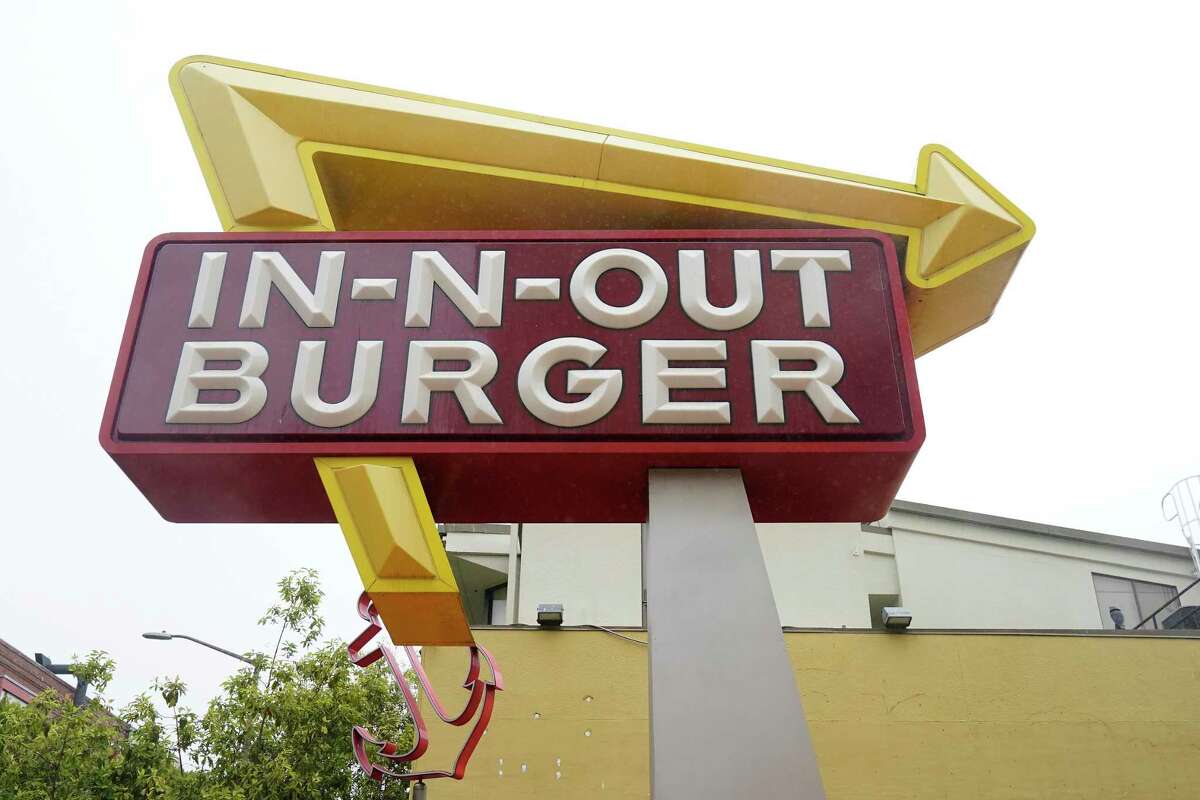 The sign to an In-N-Out restaurant is shown in San Francisco's Fisherman's Wharf, Wednesday, Oct. 20, 2021. 