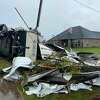 A tornado flipped a recreation vehicle on its side in Sandy Oaks subdivision
