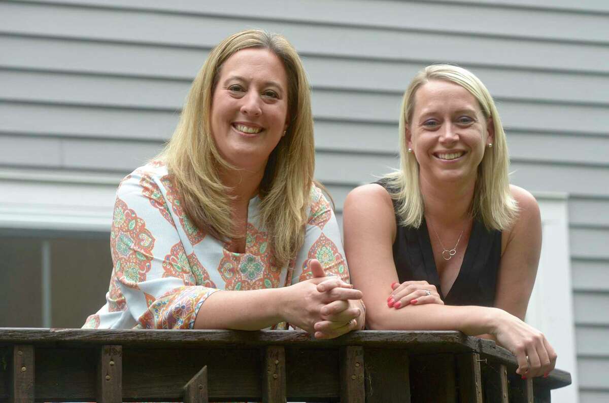 Jenn Larkin, left, and Janet Kuzma, of Newtown, both are parents of students in Newtown schools on Thursday, June 3, 2021, in Newtown, Conn. They are among two of three Republicans who have dropped out of a forum for school board candidates.