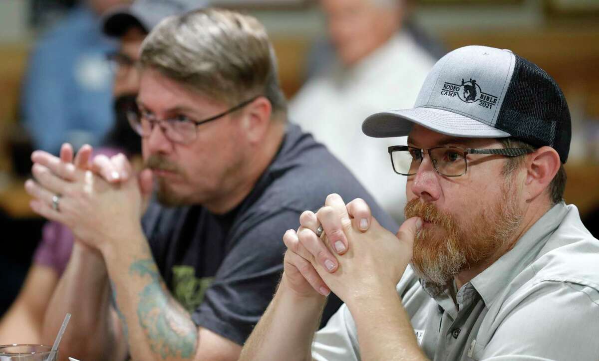 Navy veteran Anthony Wren, right, listens beside fellow vet Michael McCurry as officials with St. Thomas University announced a new program to help veterans launch their own businesses at Honor Café, Wednesday, Oct. 27, 2021, in Conroe.
