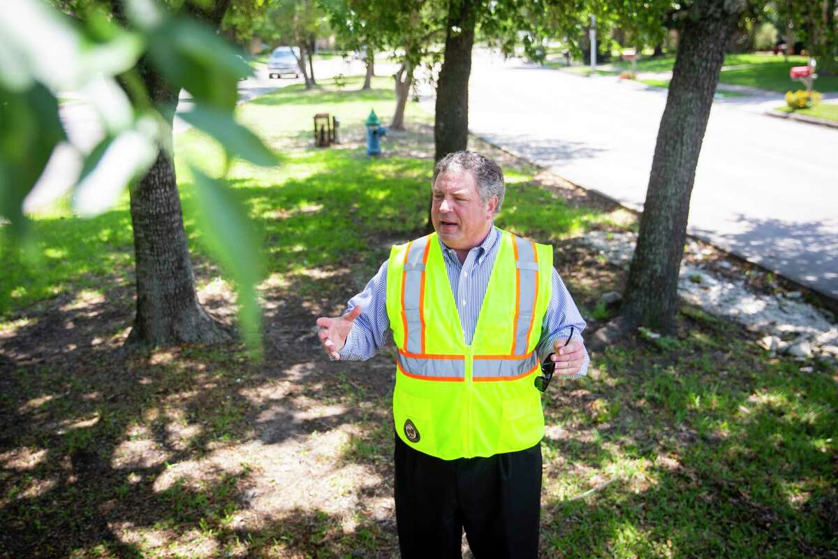 District G City Councilman Greg Travis explains road projects along a tree-lined median in Kirkwood near Briar Forest Drive last year. Travis announced Wednesday he is resigning his post at City Hall to run for a seat in the Texas House of Representatives.