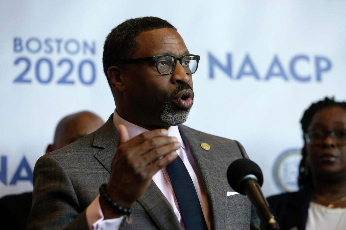 FILE - In this Thursday, Dec. 12, 2019 file photo, National Association for the Advancement of Colored People President Derrick Johnson faces reporters during a news in Boston, held to announce that the NAACP's 111th national convention is to take place in Boston, in July of 2020. Emails and recordings obtained by The Associated Press show that the NAACP's national president chastised women who went public with a sexual harassment claim. The records also show that Johnson was reluctant to swiftly deal with accusations against a former North Carolina officer in the civil rights organization. The emails also indicate that he knew about the complaint two years before he says he did. (AP Photo/Steven Senne, File)