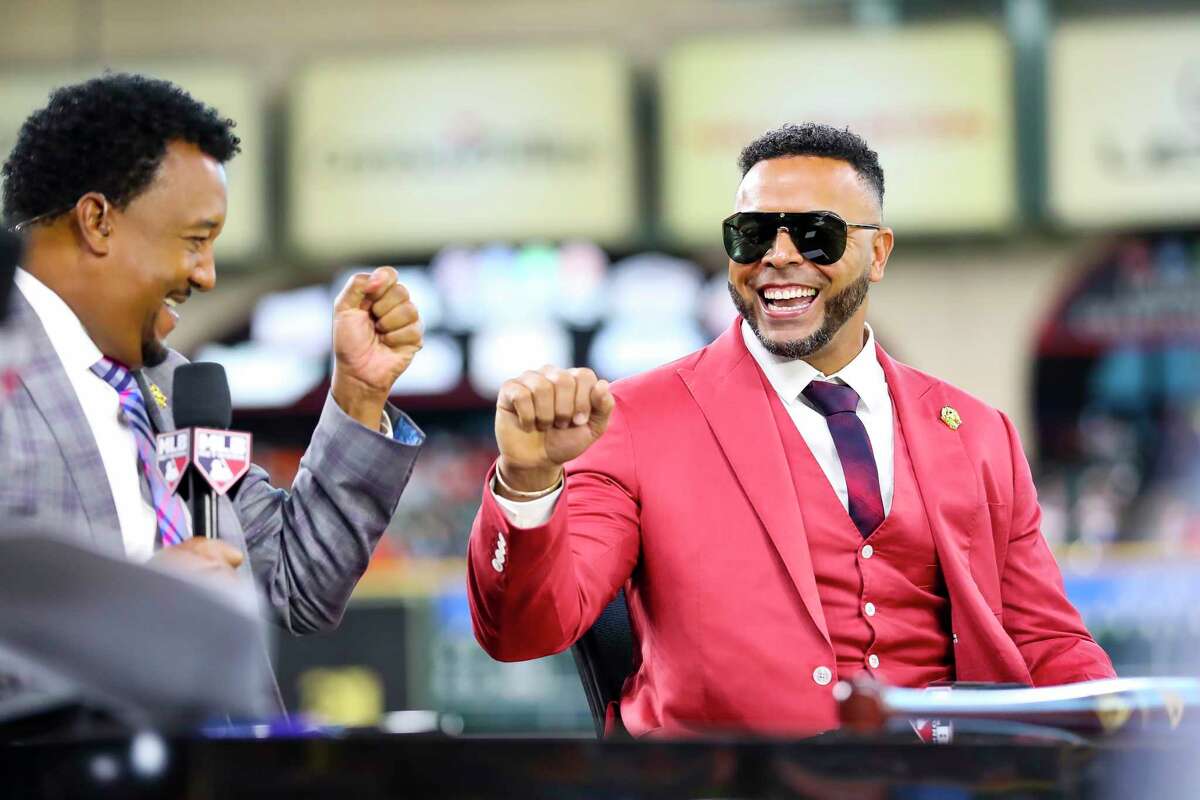 Nelson Cruz, left, talks with Pedro Martinez before Game 2 of the World Series on Wednesday, Oct. 27, 2021 at Minute Maid Park in Houston.