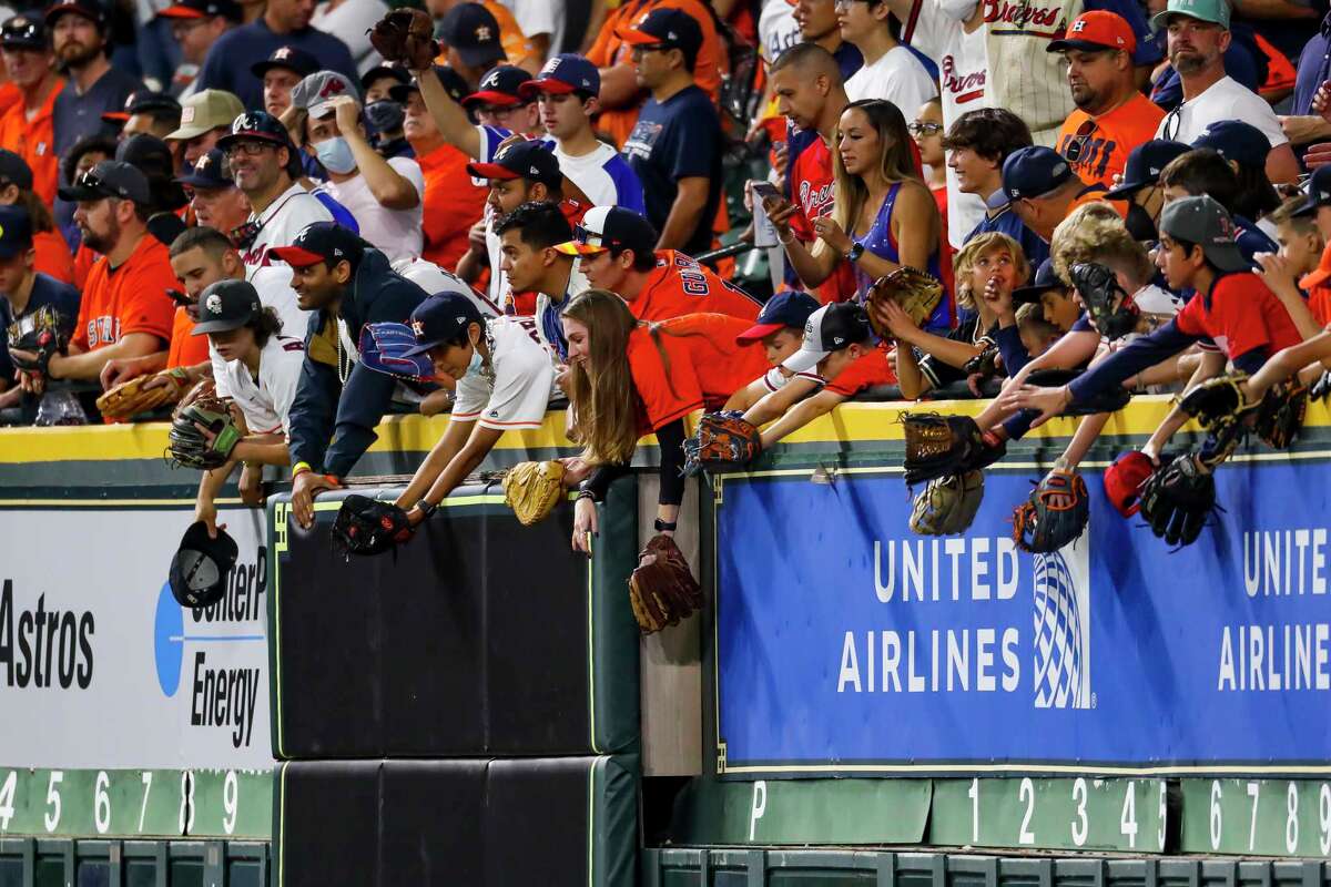Fans in the Crawford Boxes ask for balls during batting practice before Game 2 of the World Series on Wednesday, Oct. 27, 2021 at Minute Maid Park in Houston.