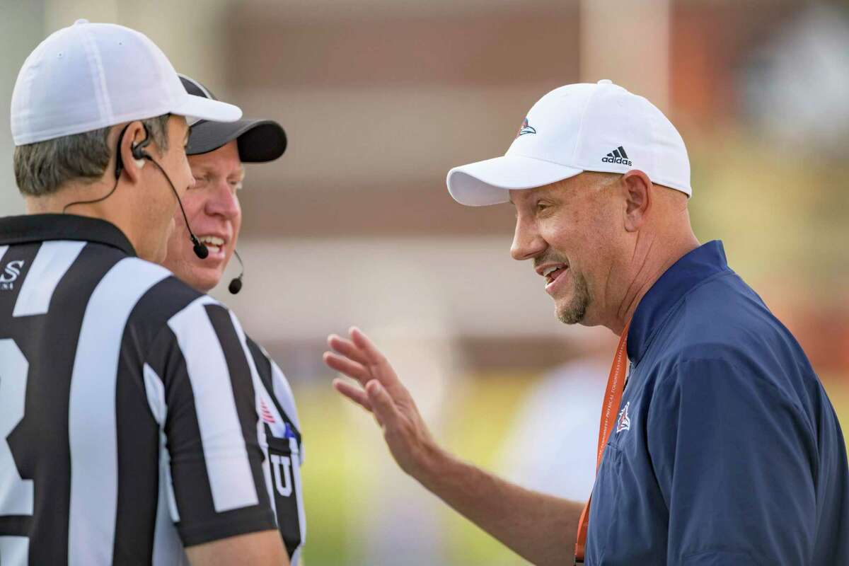 UTSA head coach Jeff Traylor, right, talks to referees before an NCAA college football game against Louisiana Tech in Ruston, La., Saturday, Oct. 23, 2021.
