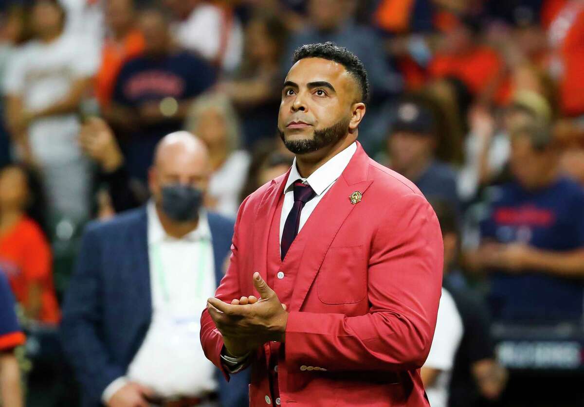 Nelson Cruz listens as he accepts the Roberto Clemente award before Game 2 of the World Series on Wednesday, Oct. 27, 2021 at Minute Maid Park in Houston.