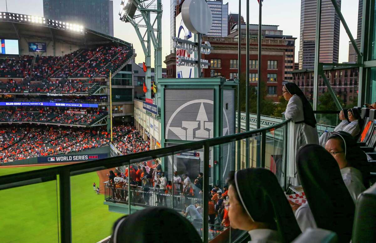 The "Rally Nuns" watch as the roof is opened before Game 2 of the World Series on Wednesday, Oct. 27, 2021 at Minute Maid Park in Houston.