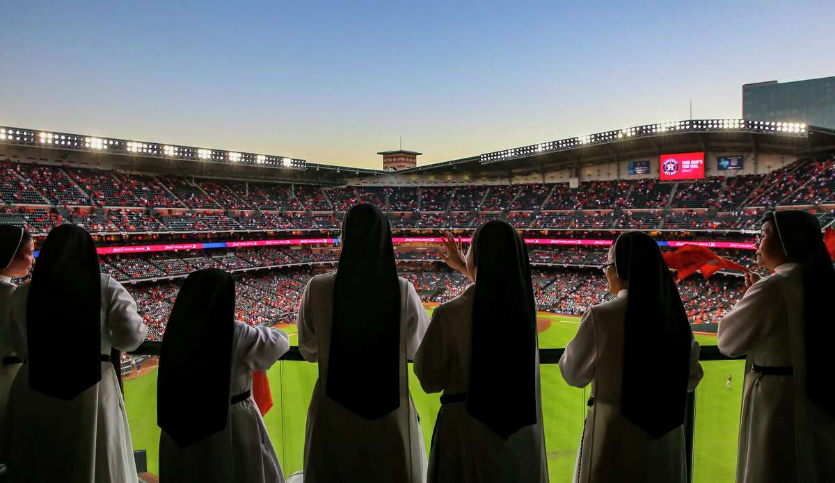 The "Rally Nuns" watch as the roof is opened before Game 2 of the World Series on Wednesday, Oct. 27, 2021 at Minute Maid Park in Houston.