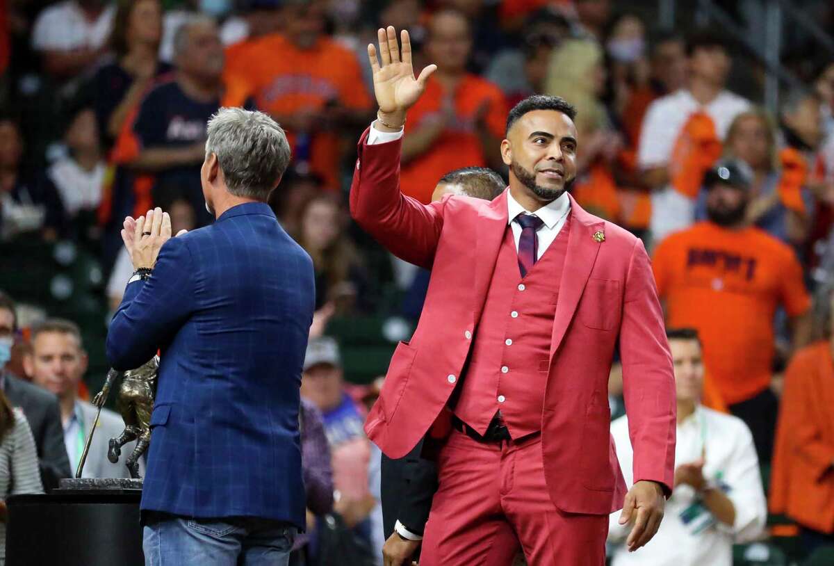 Nelson Cruz waves to the crowd as he accepts the Roberto Clemente award before Game 2 of the World Series on Wednesday, Oct. 27, 2021 at Minute Maid Park in Houston.