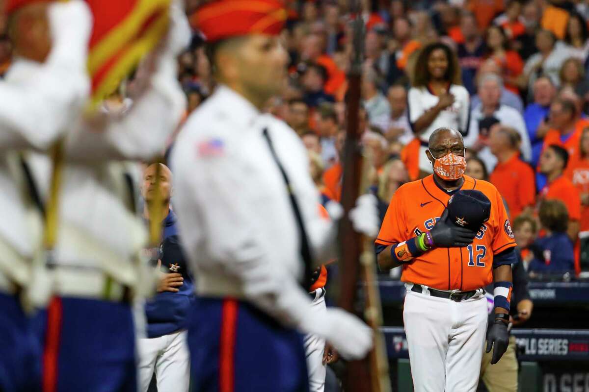Houston Astros manager Dusty Baker Jr. (12) listens to the National Anthem before Game 2 of the World Series on Wednesday, Oct. 27, 2021 at Minute Maid Park in Houston.