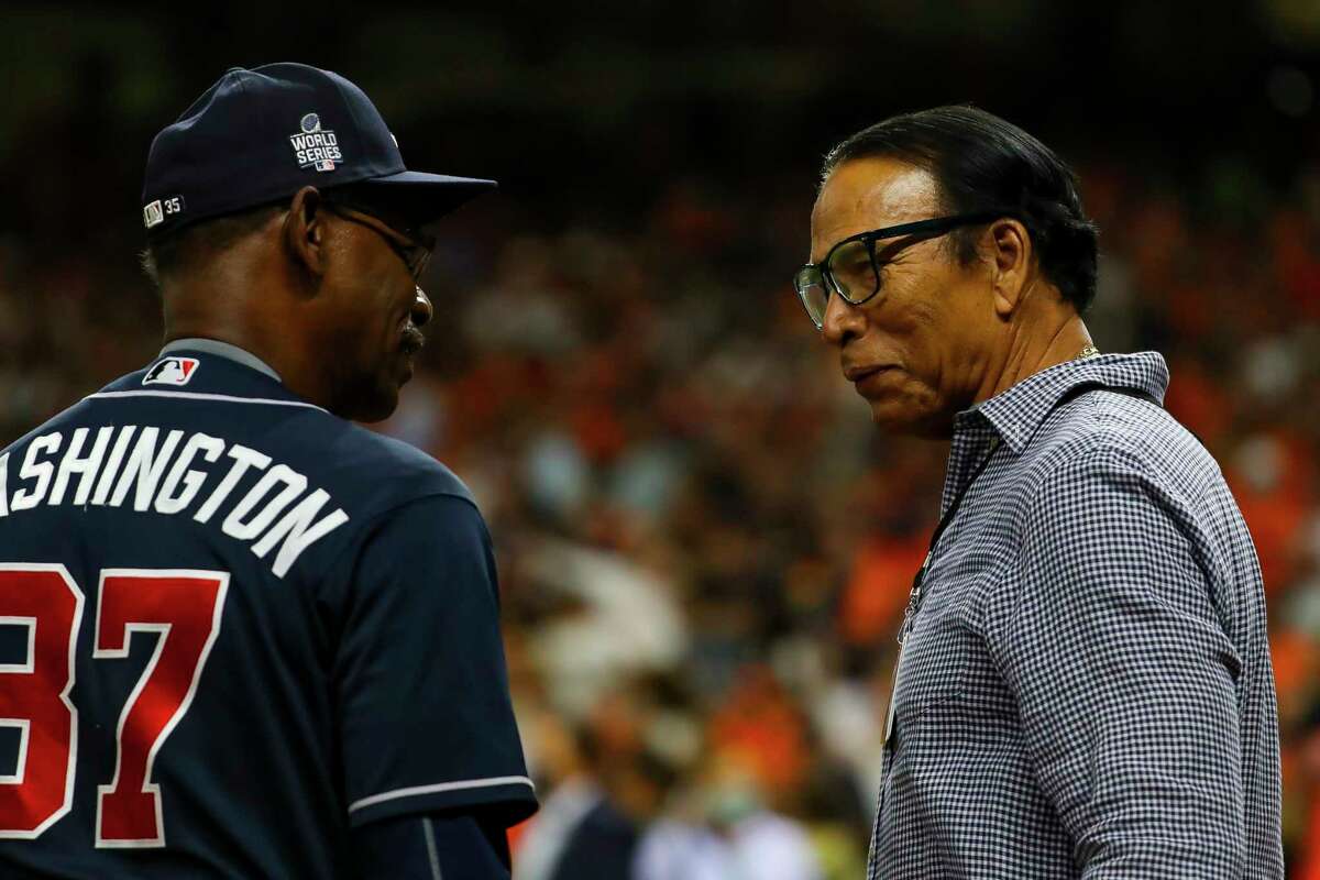 Jose Cruz speaks to Atlanta Braves third base coach Ron Washington (37) before Game 2 of the World Series on Wednesday, Oct. 27, 2021 at Minute Maid Park in Houston.