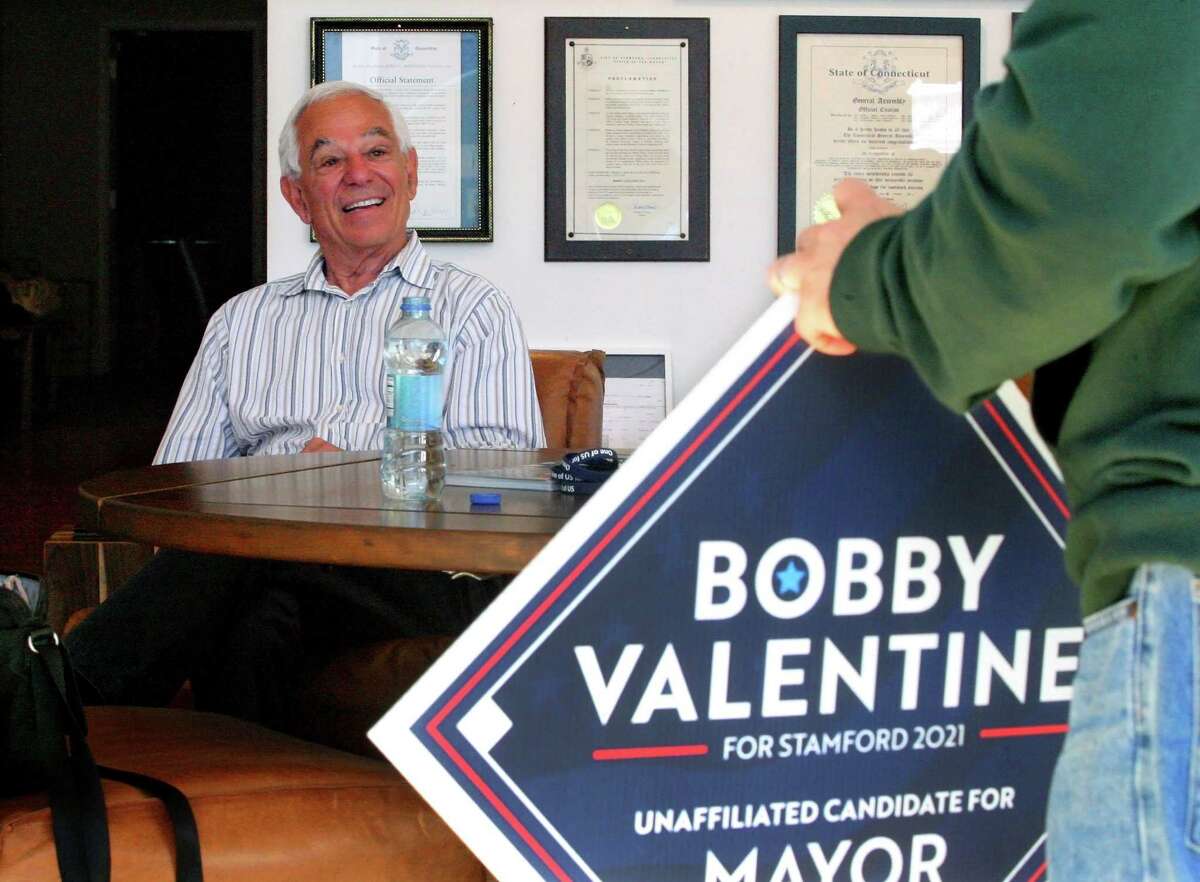 Bobby Valentine, who is running as an unaffiliated candidate for mayor of Stamford, chats with works at his campaign headquarters on Friday.