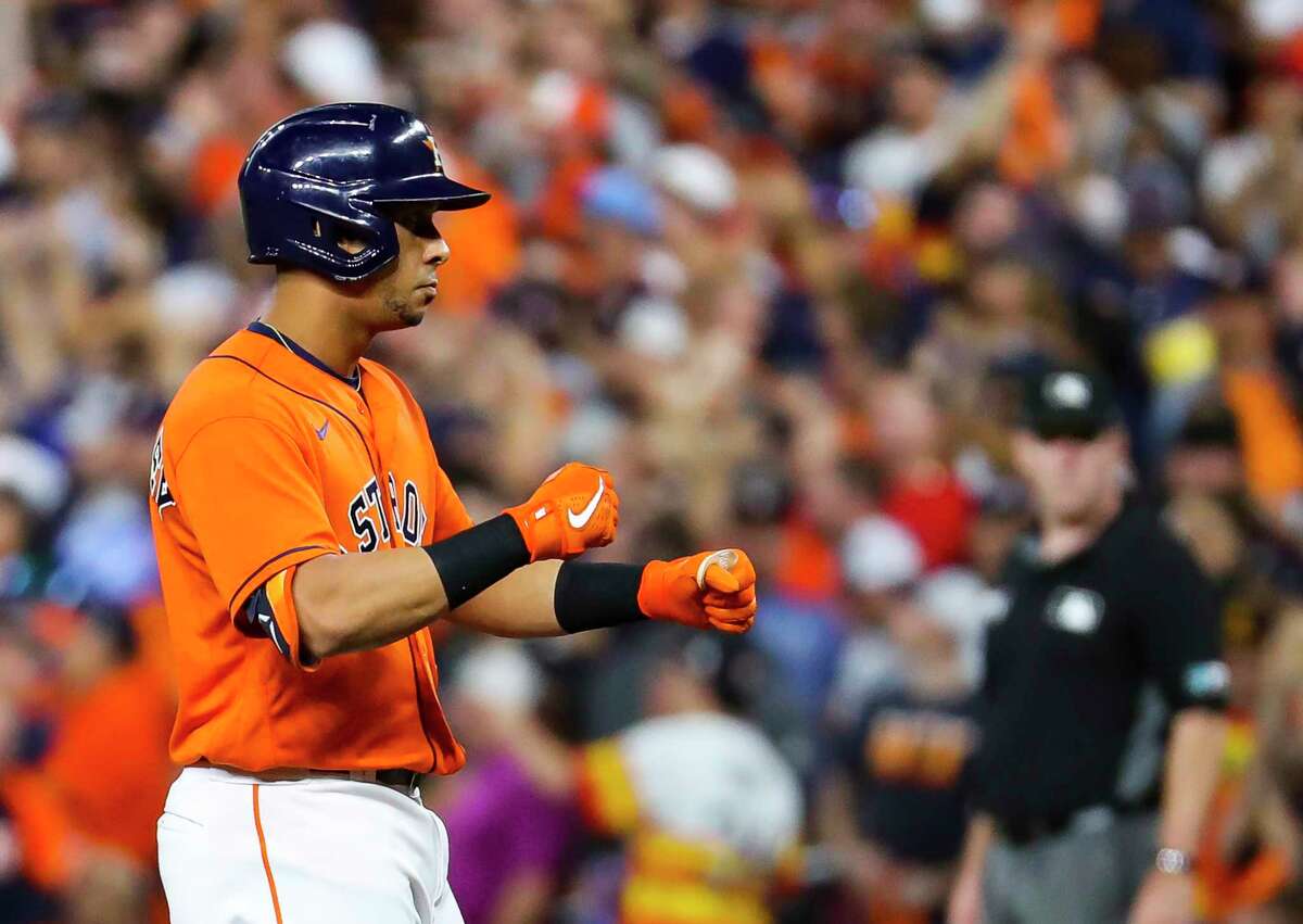 Houston Astros left fielder Michael Brantley (23) celebrates after hitting an RBI single that scores Houston Astros first baseman Yuli Gurriel (10) giving the Astros a 5-1 lead during the second inning in Game 2 of the World Series on Wednesday, Oct. 27, 2021 at Minute Maid Park in Houston.