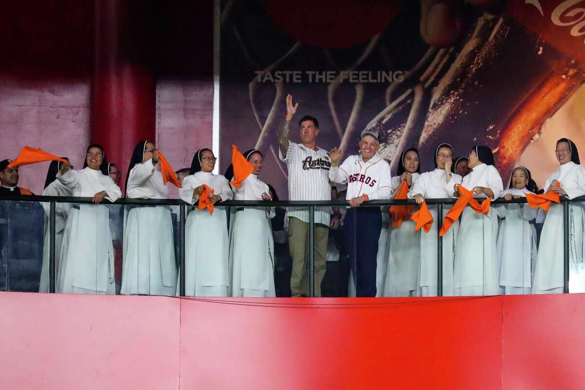 Mattress Mack waves with the "rally nuns" during the fourth inning in Game 2 of the World Series on Wednesday, Oct. 27, 2021 at Minute Maid Park in Houston.