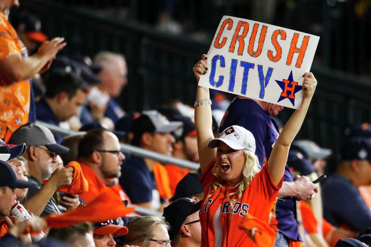 Astros fans cheer during the third inning of Game 2 of the World Series on Wednesday, Oct. 27, 2021 at Minute Maid Park in Houston.