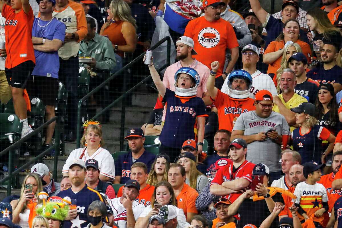 Astros fans cheer during the third inning of Game 2 of the World Series on Wednesday, Oct. 27, 2021 at Minute Maid Park in Houston.