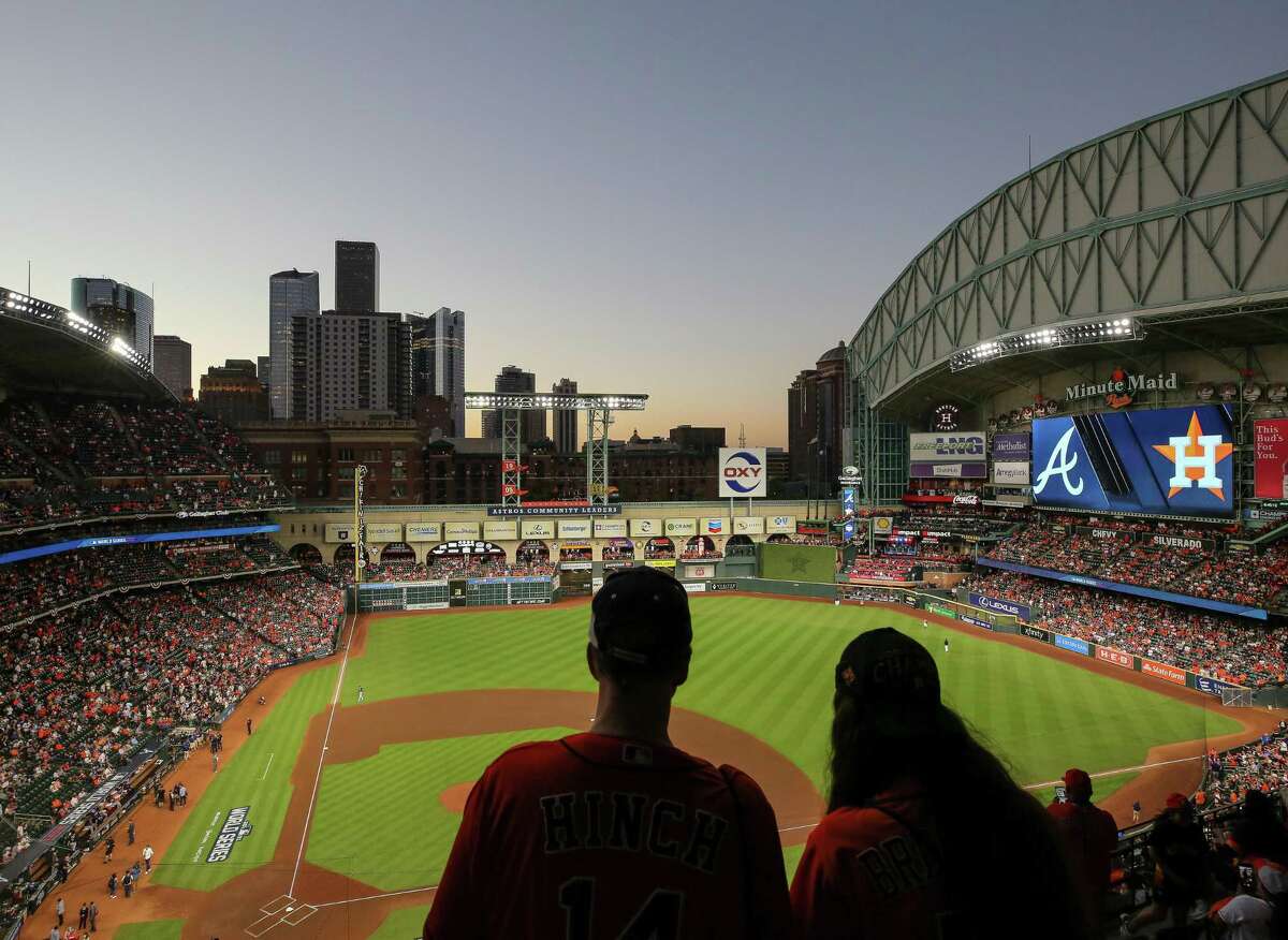 Houston Astros fans look for their seats before Game 2 of the World Series against the Atlanta Braves at Minute Maid Park on Wednesday, Oct. 27, 2021, in Houston.