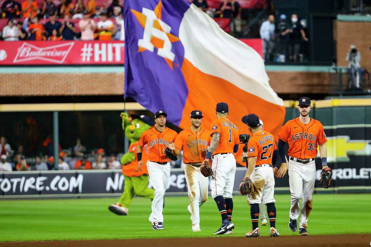 The Astros celebrate at the end of their 7-2 win of Game 2 of the World Series on Wednesday, Oct. 27, 2021 at Minute Maid Park in Houston.