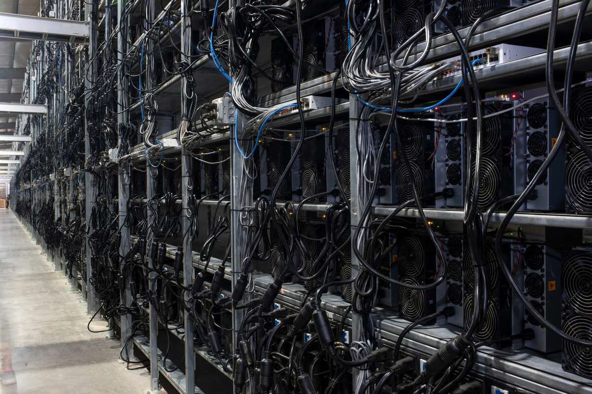 Bitcoin mining machines in a warehouse at the Whinstone US Bitcoin mining facility in Rockdale, Texas, on October 10.