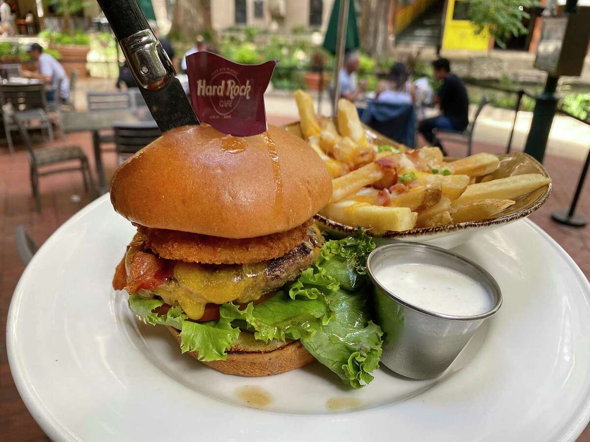 The legendary Steak Burger is filled with bacon, cheddar cheese, and a fried onion ring at the Hard Rock Cafe on the River Walk.