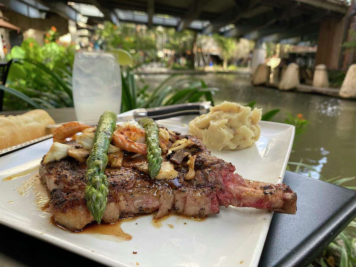 Ribeye Valentino is a 20 oz bone-in rib eye topped with scallops, shrimp and crab at Landry's Seafood House on the River Walk. The bar also mixes an upscale Perfect Patrón margarita with Patrón Silver tequila and Cointreau.