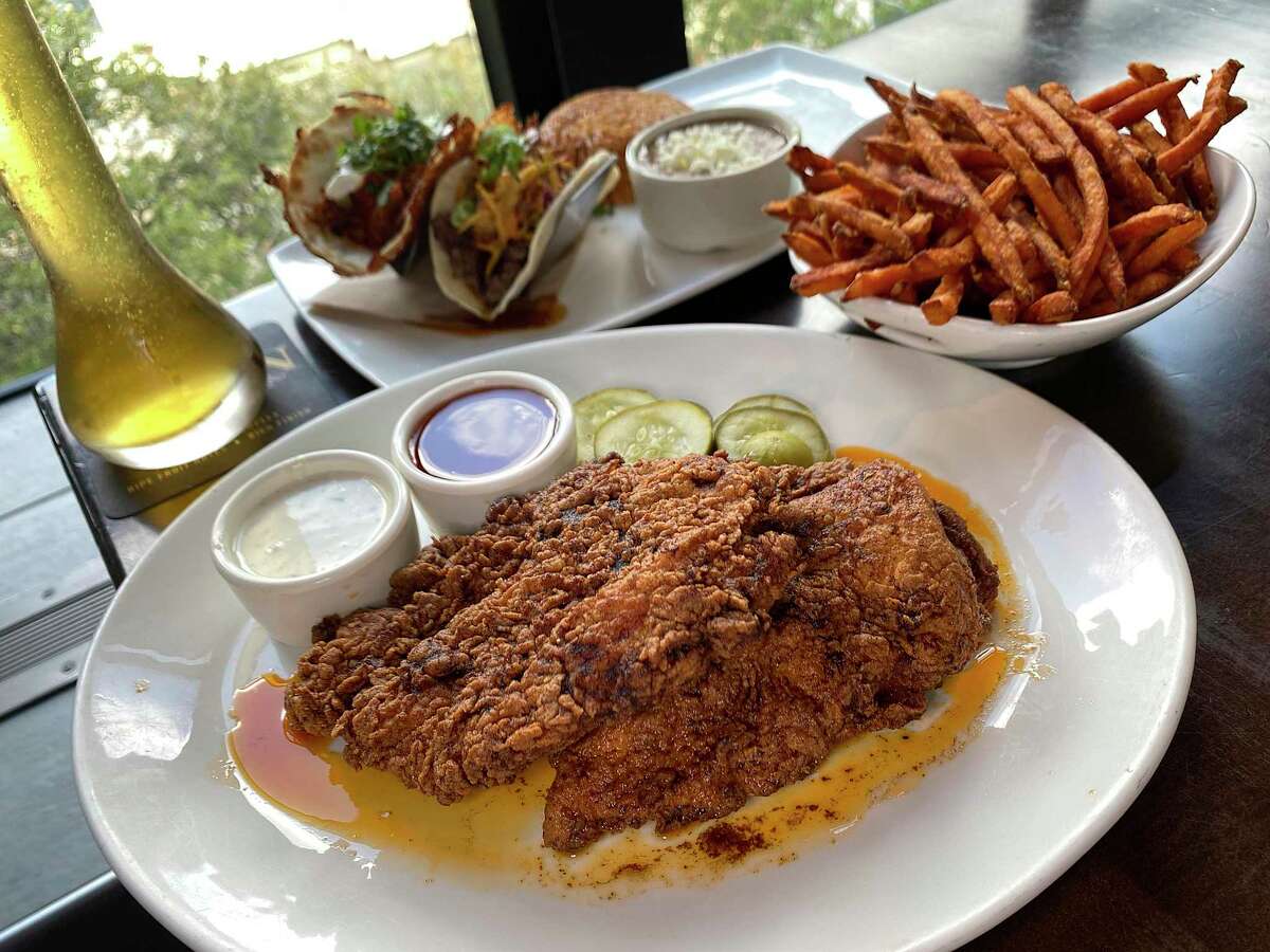 Nashville fried chicken, draft beer served in half-yard glasses, and tacos are part of the menu at the Yard House on the River Walk.