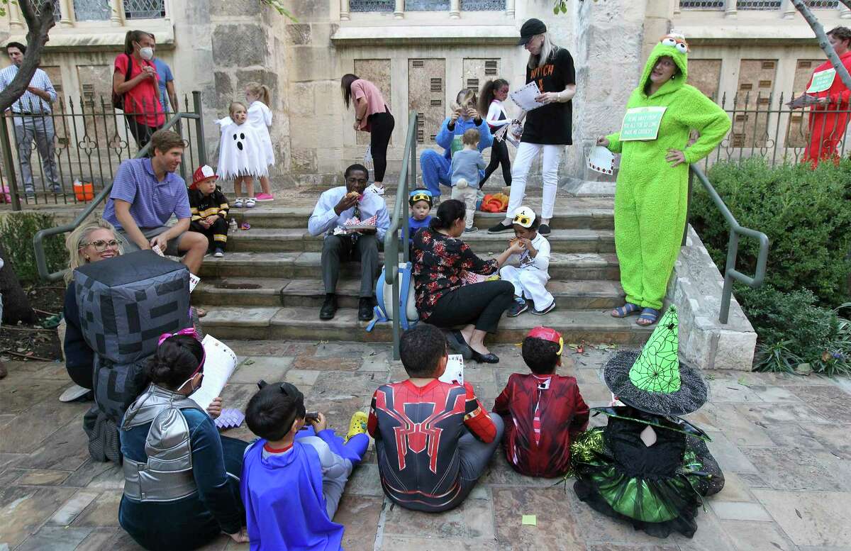 Children gather to sing Halloween-inspired songs Wednesday evening during annual festivities at St. Mark’s Episcopal Church in downtown.