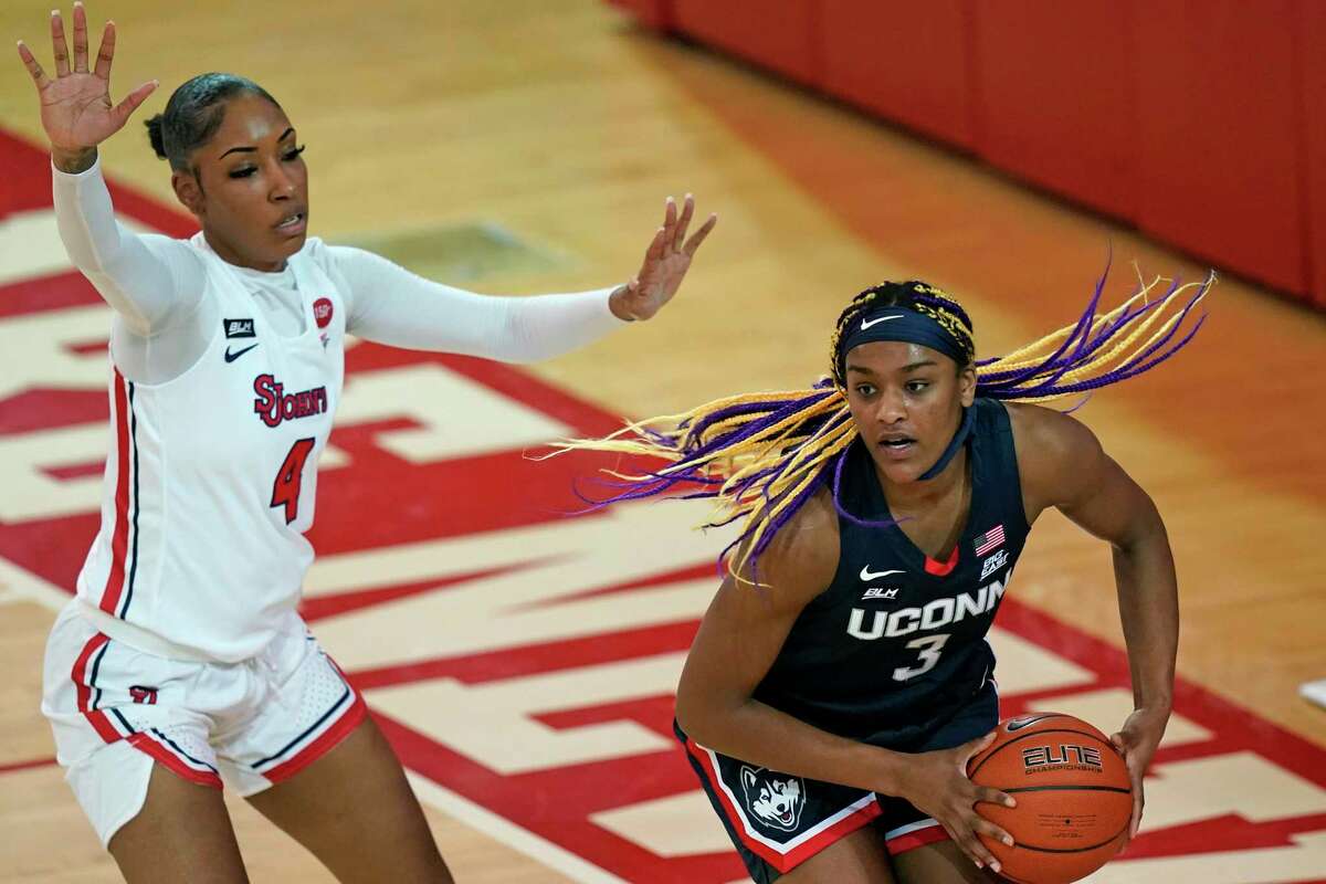 St. John's forward Raven Farley (4) defends Connecticut forward Aaliyah Edwards (3) during the third quarter of an NCAA college basketball game, Wednesday, Feb. 17, 2021, at St. John's University in the Queens borough of New York. (AP Photo/Kathy Willens)