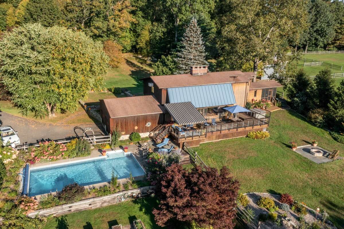 The home on 14 Old Boston Post Drive in Roxbury, Conn. has a heated pool on its 7 acres of land. 