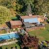 The home on 14 Old Boston Post Drive in Roxbury, Conn. has a heated pool on its 7 acres of land. 