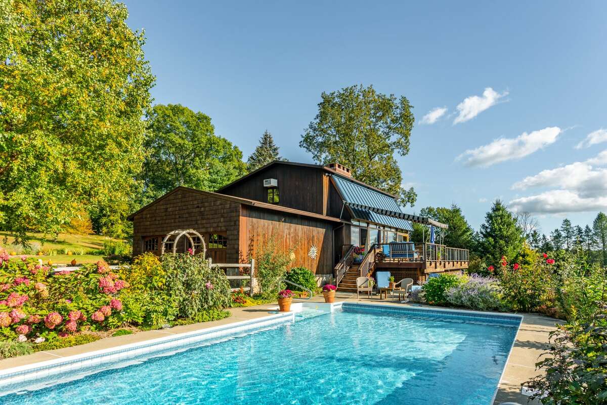 The home on 14 Old Boston Post Drive in Roxbury, Conn. has a heated pool