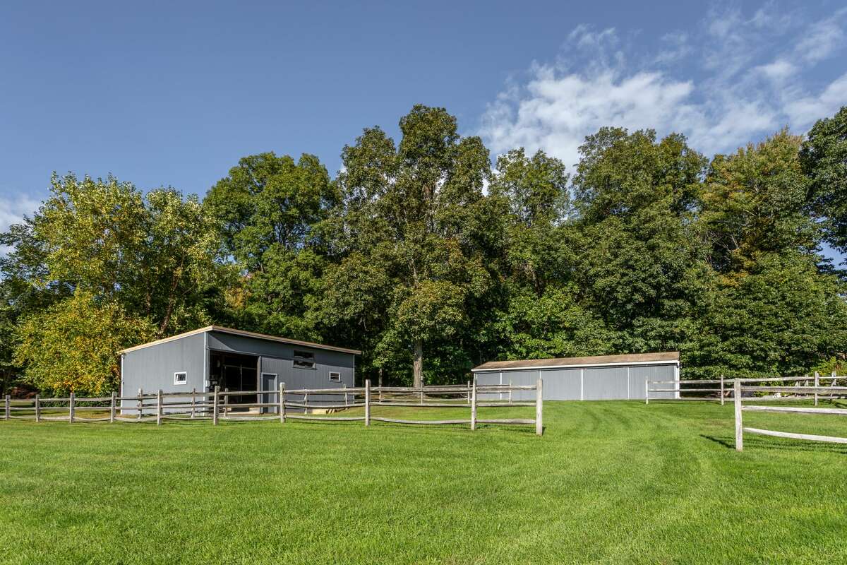 The horse paddocks and barn at the home on 14 Old Boston Post Drive in Roxbury, Conn. 